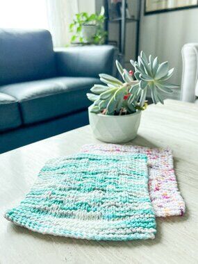 Four new hand-knitted waffle design cotton dishcloths.